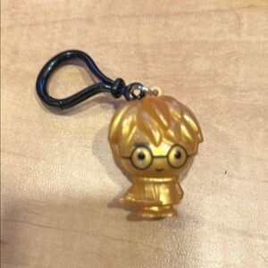 Golden Harry Potter With Wand Harry Potter​
